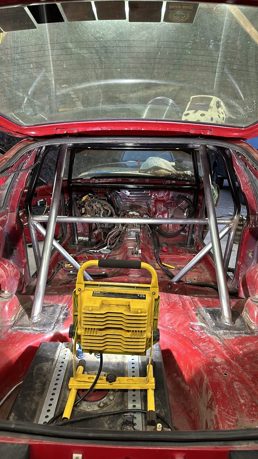 A finished roll cage seen from above in a stripped shell